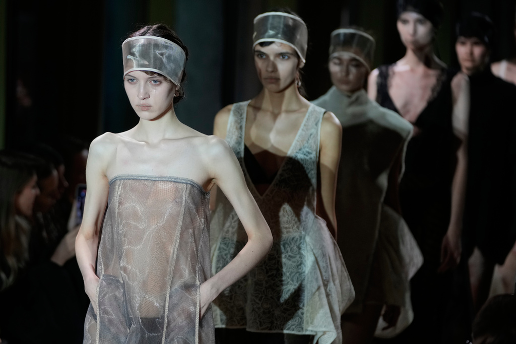 Models wear creations by Russian brand Ruban on a runway at the Moscow Fashion Week in Moscow, Tuesday, March 17, 2026. (AP Photo/Pavel Bednyakov)