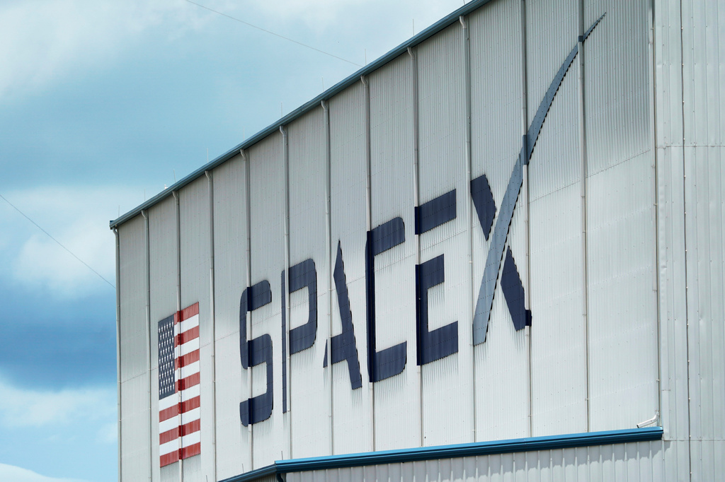 FILE - The SpaceX logo is displayed on a building, May 26, 2020, at the Kennedy Space Center in Cape Canaveral, Fla. (AP Photo/David J. Phillip, File)