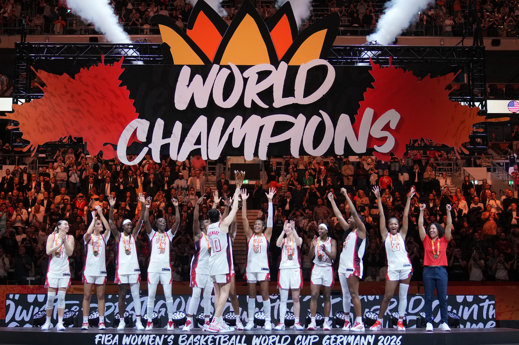 United States team stands on the podium after winning the Women's Basketball World Cup final match between the United States and France in Berlin, Sunday, Sept. 13, 2026. (AP Photo/Ebrahim Noroozi)