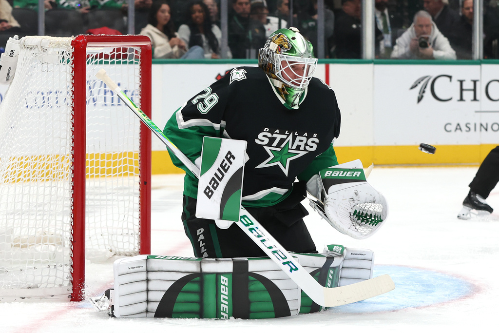 Dallas Stars goaltender Jake Oettinger blocks a shot during the second period of an NHL hockey game against the Pittsburgh Penguins, Sunday, Dec. 7, 2025, in Dallas. (AP Photo/Sam Hodde)