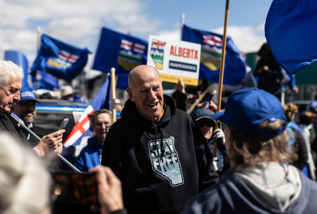 Mitch Sylvestre talks with supporters before he submits his signatures for a separation referendum to Elections Alberta in Edmonton, on Monday, May 4, 2026. (Jason Franson/The Canadian Press via AP)