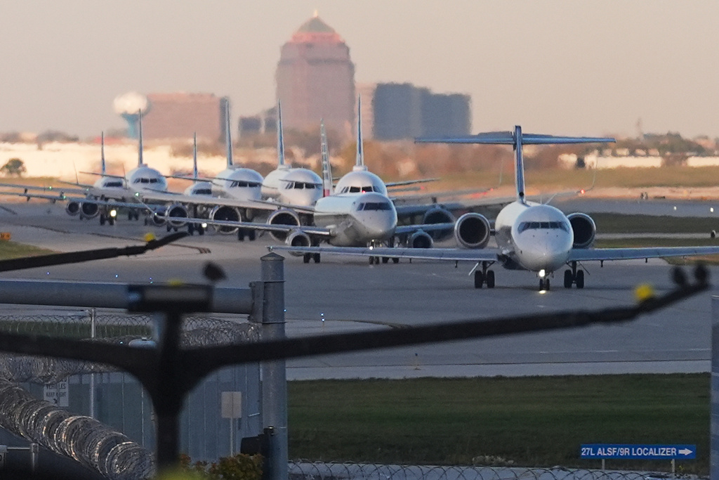 Planes taxi to terminals at O'Hare International Airport in Chicago, Monday, Nov. 3, 2025. (AP Photo/Nam Y. Huh)