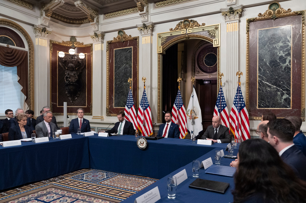 From left, Education Secretary Linda McMahon, Health and Human Services Secretary Robert F. Kennedy Jr., Department of Treasury Secretary Scott Bessent, Federal Trade Commission Chairman Andrew Ferguson, Vice President JD Vance and White House deputy chief of staff Stephen Miller attend the first meeting of the newly formed national Task Force to Eliminate Fraud in the Indian Treaty Room at the Eisenhower Executive Office Building on the White House complex in Washington, Friday, March 27, 2026. (AP Photo/Manuel Balce Ceneta)