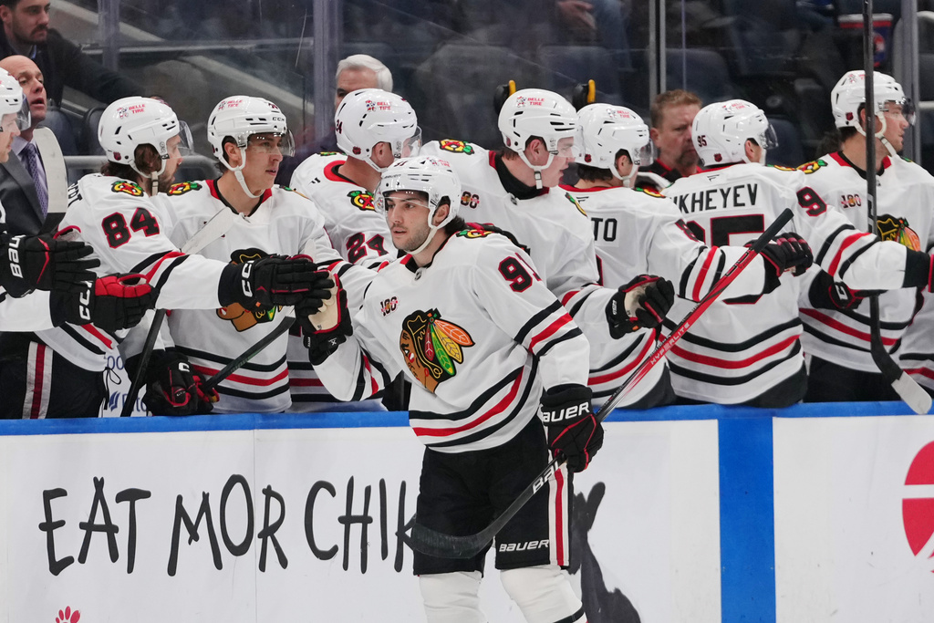 Chicago Blackhawks' Frank Nazar (91) celebrates with teammates after scoring a goal during the second period of an NHL hockey game against the New York Islanders Tuesday, March 24, 2026, in Elmont, N.Y. (AP Photo/Frank Franklin II)