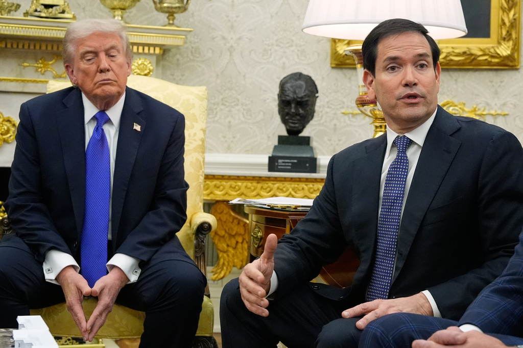 President Donald Trump listens as Secretary of State Marco Rubio speaks during a meeting with NATO Secretary General Mark Rutte in the Oval Office of the White House, Wednesday, Oct. 22, 2025, in Washington. (AP Photo/Alex Brandon)