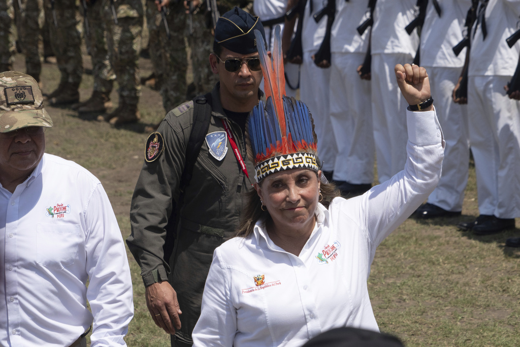 Peru's President Dina Boluarte reviews troops during a visit to Santa Rosa, Peru, an island on the Amazon River at the triple border with Colombia and Brazil, amid a territorial dispute with Colombia, Friday, Aug. 15, 2025. (AP Photo/Daniel Padilla)