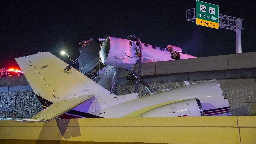The wreckage of a business jet sits on Loop 20 near the Clark Boulevard exit in Laredo, Texas, on Tuesday, June 16, 2026. (Jose De La Rosa/The Laredo Morning Times via AP)