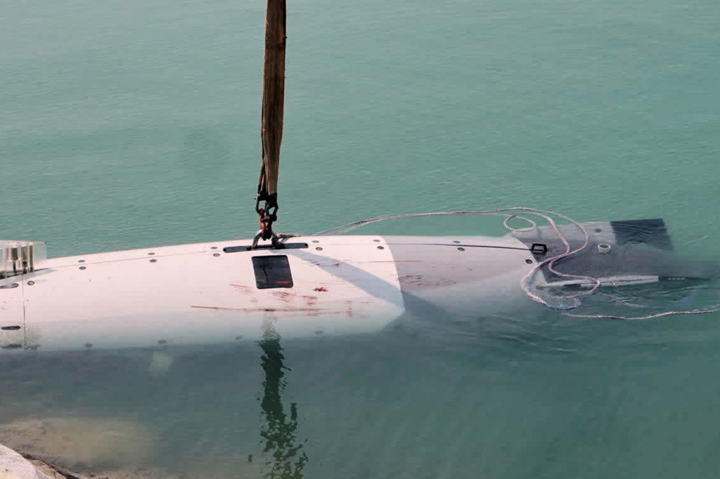 This image provided by Sepahnews, the official website of Iran's Revolutionary Guard, shows what Iran's navy and state television described as a captured U.S. military underwater drone at the entrance to the Strait of Hormuz, Tuesday, Sept. 8, 2026. (Sepahnews via AP)
