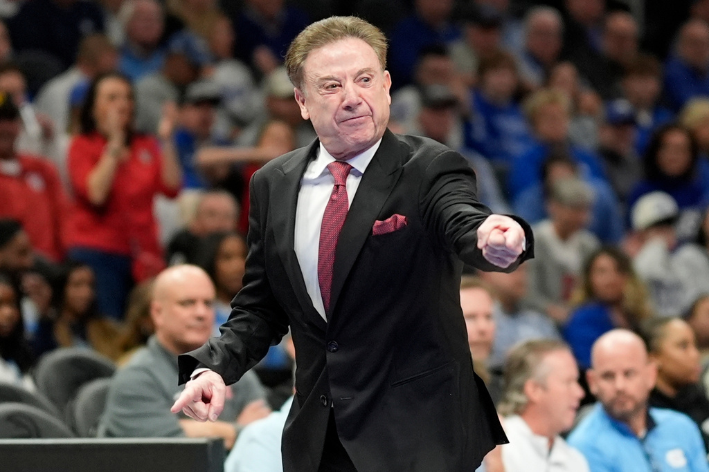 St. John's head coach Rick Pitino speaks during the first half of an NCAA basketball game against Kentucky, Saturday, Dec. 20, 2025, in Atlanta. (AP Photo/Mike Stewart)