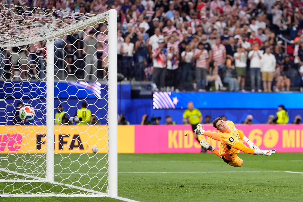 Paraguay goalkeeper Orlando Gill is airborne as he fails to stop a goal from United States' Giovanni Reyna during the World Cup Group D soccer match between the United States and Paraguay in Inglewood, Calif., near Los Angeles, Friday, June 12, 2026. (AP Photo/Mark J. Terrill)
