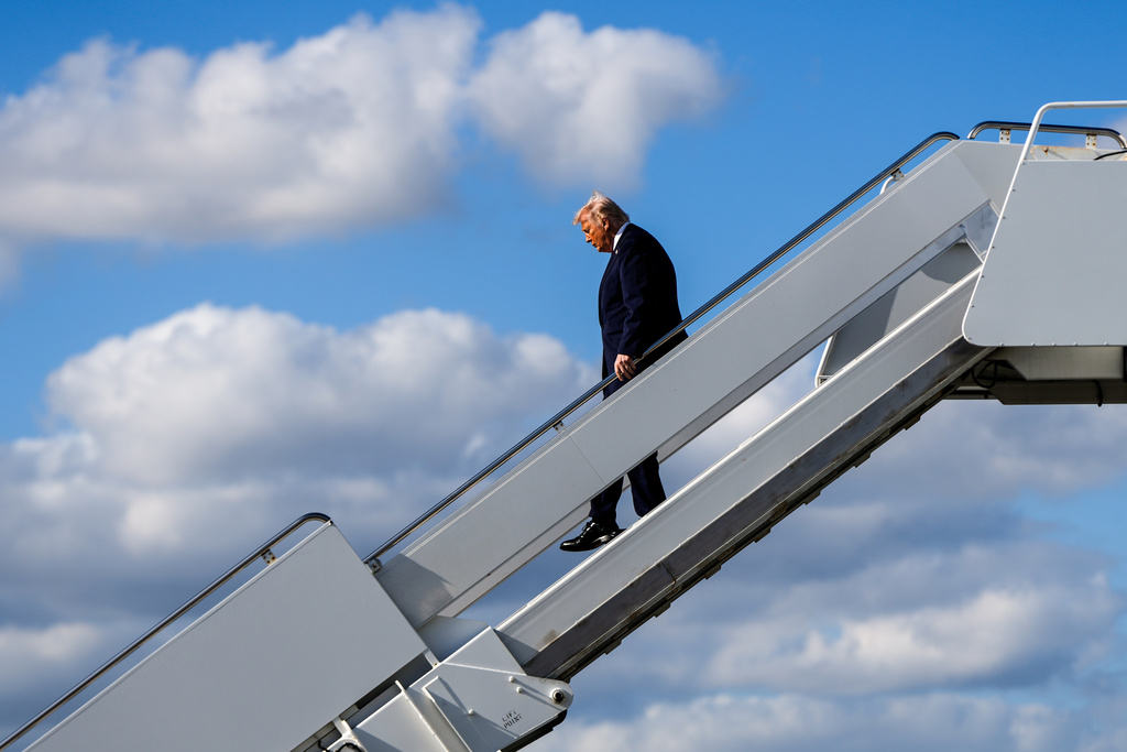 FILE - President Donald Trump disembarks Air Force One at Palm Beach International Airport, Jan. 16, 2026, in West Palm Beach, Fla. (AP Photo/Julia Demaree Nikhinson, File)