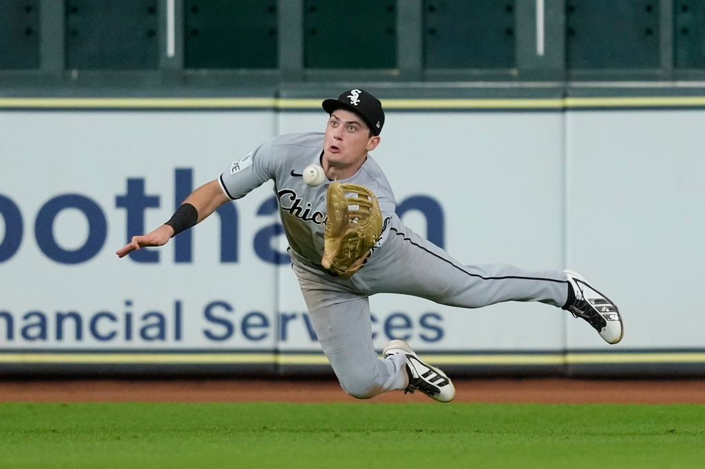 Chicago White Sox left fielder Sam Antonacci catches a line drive by Houston Astros' Nelson Velázquez during the sixth inning of a baseball game Tuesday, Sept. 1, 2026, in Houston. (AP Photo/David J. Phillip)