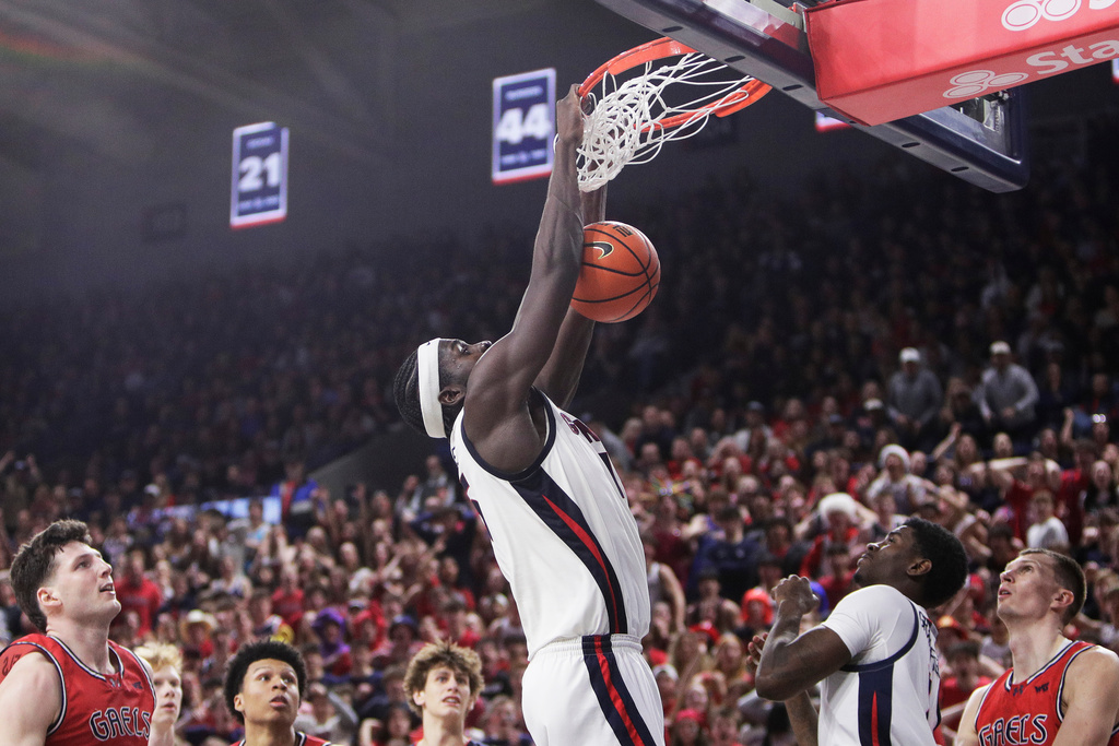 Gonzaga forward Graham Ike, center, dunks during the second half of an NCAA college basketball game against Saint Mary's, Saturday, Jan. 31, 2026, in Spokane, Wash. (AP Photo/Young Kwak)