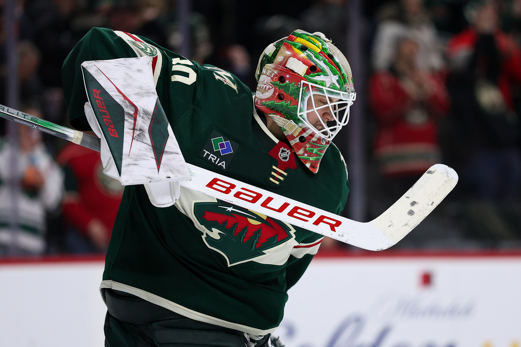 Minnesota Wild goaltender Jesper Wallstedt (30) celebrates the team's win over the Ottawa Senators after an NHL hockey game Saturday, Dec. 13, 2025, in St. Paul, Minn. (AP Photo/Matt Krohn)