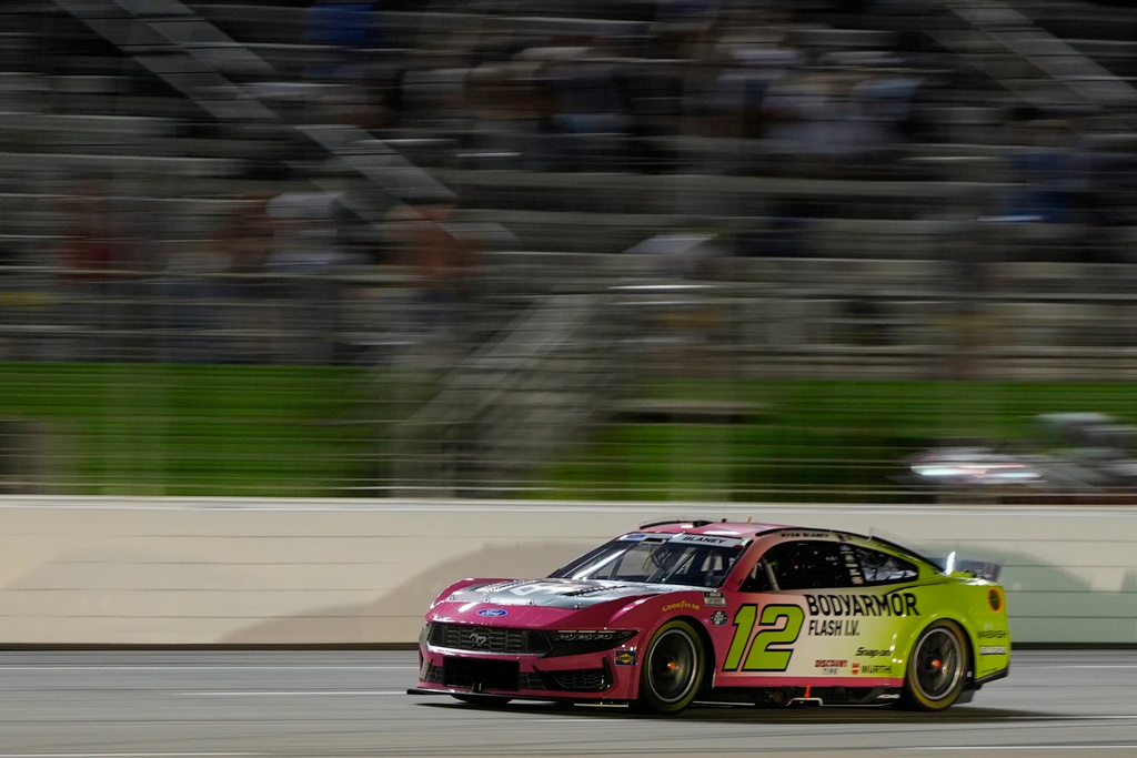 Ryan Blaney (12) moves during a NASCAR Cup Series auto race, Sunday, July 12, 2026, in Hampton, Ga. (AP Photo/Mike Stewart)