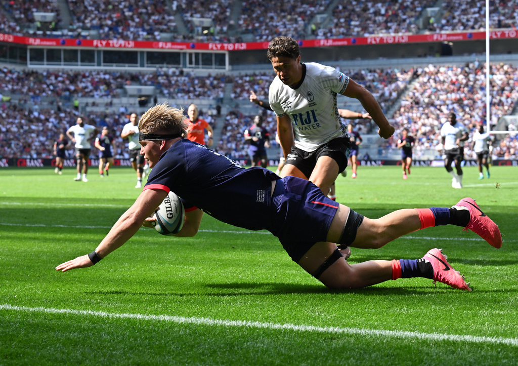 England's Henry Pollock scores a try during the Nations Championship rugby match between England and Fiji in Liverpool, England, Saturday, July 11, 2026. (Bruce Rollinson/PA via AP)