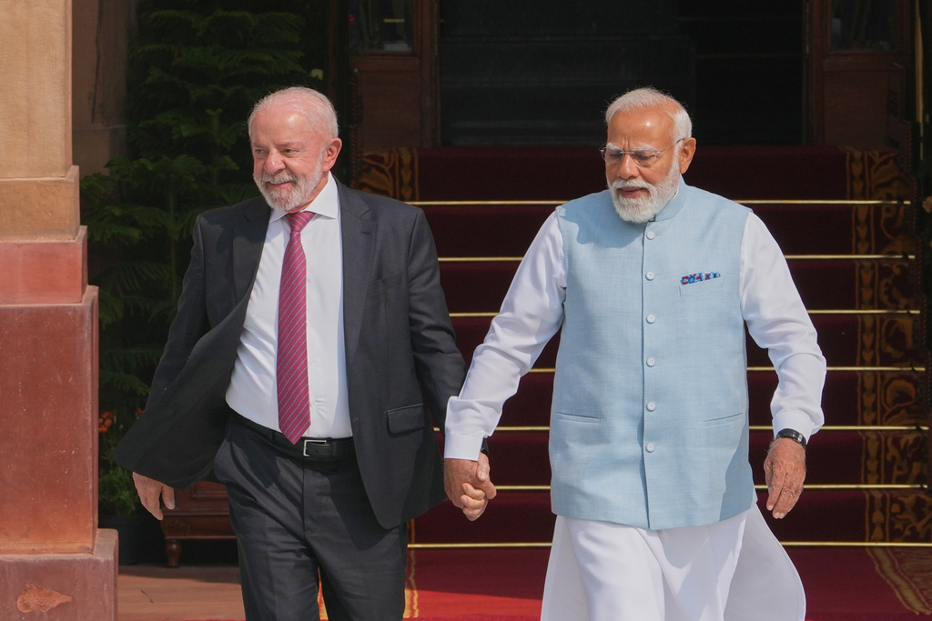 Indian Prime Minister Narendra Modi, right, walks with Brazilian President Luiz Inacio Lula da Silva for a photo call before their delegation level meeting in New Delhi, India, Saturday, Feb. 21, 2026. (AP Photo/Manish Swarup)