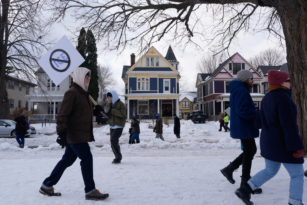 Protesters gather during a rally for Renee Good, who was fatally shot by an ICE officer earlier in the week, Friday, Jan. 10, 2026, in Minneapolis. (AP Photo/Jen Golbeck)