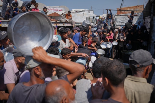 Palestinians line up to get donated food at a community kitchen in Khan Younis, southern Gaza Strip, saturday, Sept. 27, 2025. (AP Photo/Jehad Alshrafi) Palestinians line up to get donated food at a community kitchen in Khan Younis, southern Gaza Strip, saturday, Sept. 27, 2025. (AP Photo/Jehad Alshrafi)