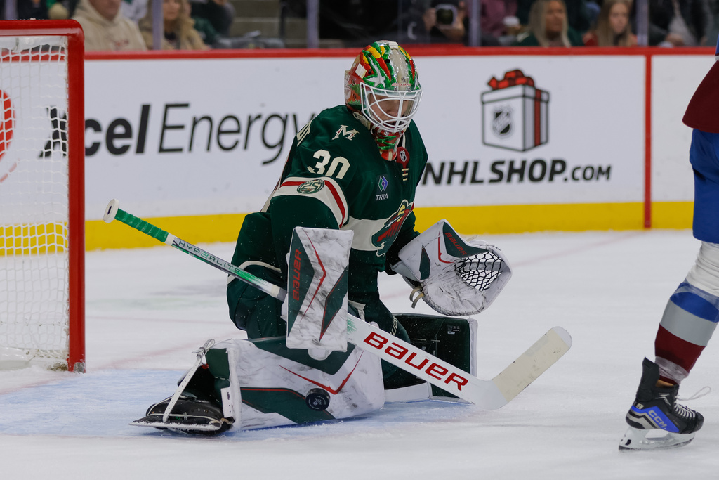 Minnesota Wild goaltender Jesper Wallstedt (30) makes a save during the second period of an NHL hockey game against the Colorado Avalanche, Friday, Nov. 28, 2025, in St. Paul, Minn. (AP Photo/Bailey Hillesheim)