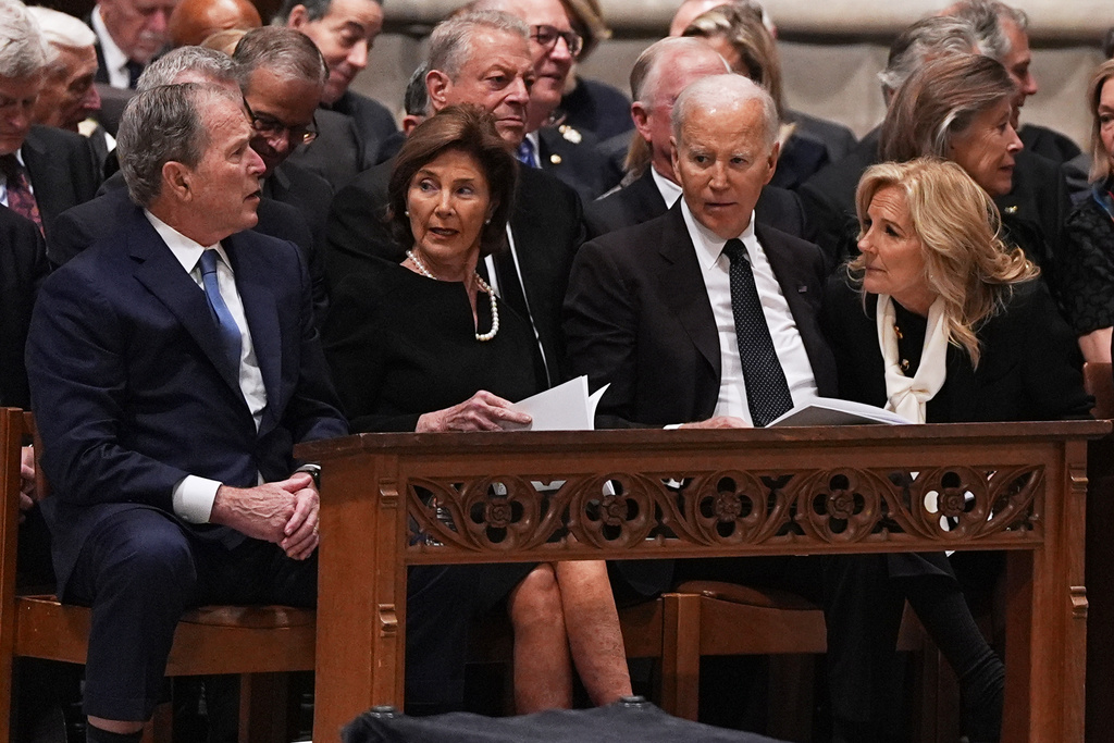 Former Presidents front row from left, George W. Bush with Laura Bush and Joe Biden with Jill Biden, talk together before the funeral service for former Vice President Dick Cheney at the Washington National Cathedral on Thursday, Nov. 20, 2025 in Washington. (AP Photo/Matt Rourke)