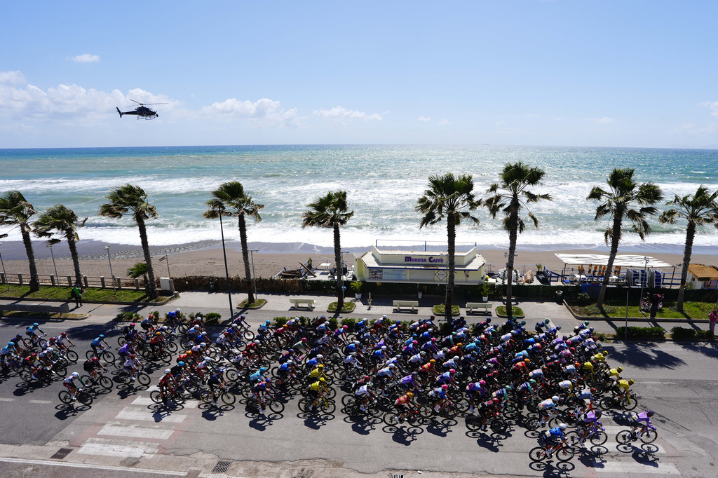 Riders pedals along the coastline during the 6th stage of the Giro d'Italia cycling race, from Paestum to Naples, Italy, Thursday, May 14, 2026. (Fabio Ferrari/LaPresse via AP)