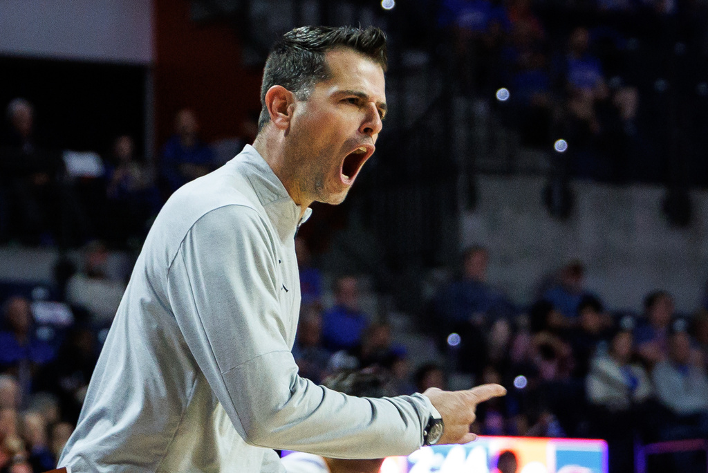 Florida head coach Todd Golden shouts from the sidelines during the first half of an NCAA college basketball game against Colgate Sunday, Dec. 21, 2025, in Gainesville, Fla. (AP Photo/Chris Watkins)