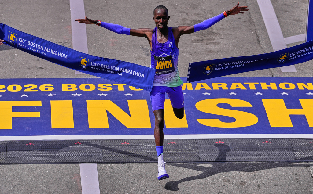 John Korir, of Kenya, breaks the tape to win the Boston Marathon, Monday, April 20, 2026, in Boston. (AP Photo/Charles Krupa)