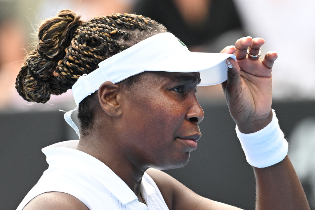 Venus Williams of the U.S. adjusts her visor while playing Magda Linette of Poland during their singles match at the ASB Classic Women's Tennis Tournament in, Auckland, New Zealand Tuesday, Jan. 6, 2026. (Andrew Cornaga/Photosport via AP)