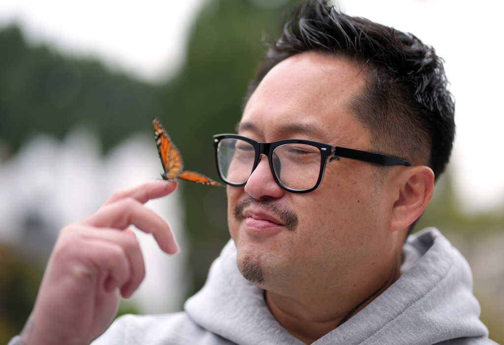 Director Ian Tuason is joined by a butterfly as he poses for a portrait to promote the film "Undertone" on Wednesday, March 4, 2026, in West Hollywood, Calif. (AP Photo/Chris Pizzello)