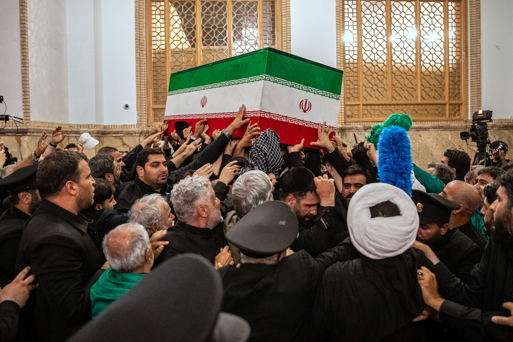 In this photo released by Iran's Supreme Leader's office, mourners carry the coffin of the late Iranian Supreme Leader Ayatollah Ali Khamenei above the crowd for the final prayer before his burial at the Imam Reza Shrine in Mashhad, northeastern Iran, Thursday, July 9, 2026. (Office of the Iranian Supreme Leader via AP)