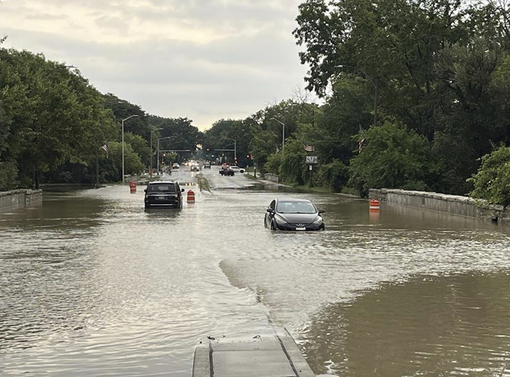 CORRECTION - CORRECTS SOURCE TO CBS58 NOT CBS28. This image provided by CBS58 (WDJT) shows cares on a flooded street in Milwaukee, Sunday, Aug. 10, 2025. (CBS58 (WDJT) via AP)