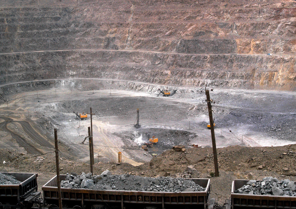 FILE - In this July 6, 2010 file photo, workers use machinery to dig at a rare earth mine in Baiyunebo mining district of Baotou in north China's Inner Mongolia Autonomous Region. (AP Photo, File)