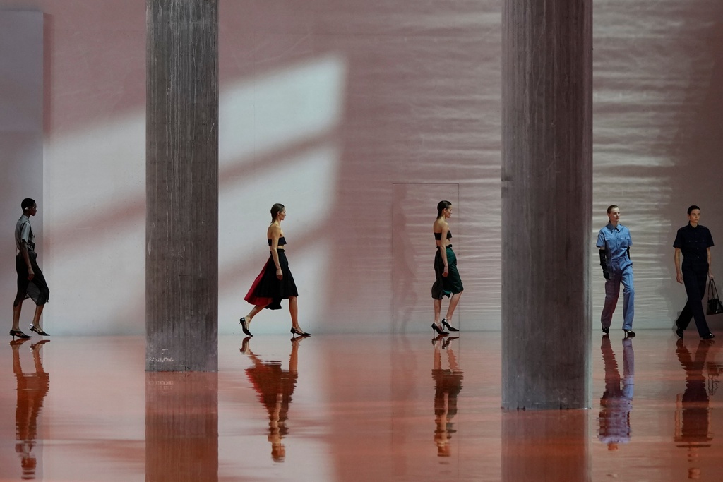 Models wear creations as part of the Prada Spring/Summer 2026 collection presented in Milan, Italy, Thursday, Sept. 25, 2025. (AP Photo/Luca Bruno)