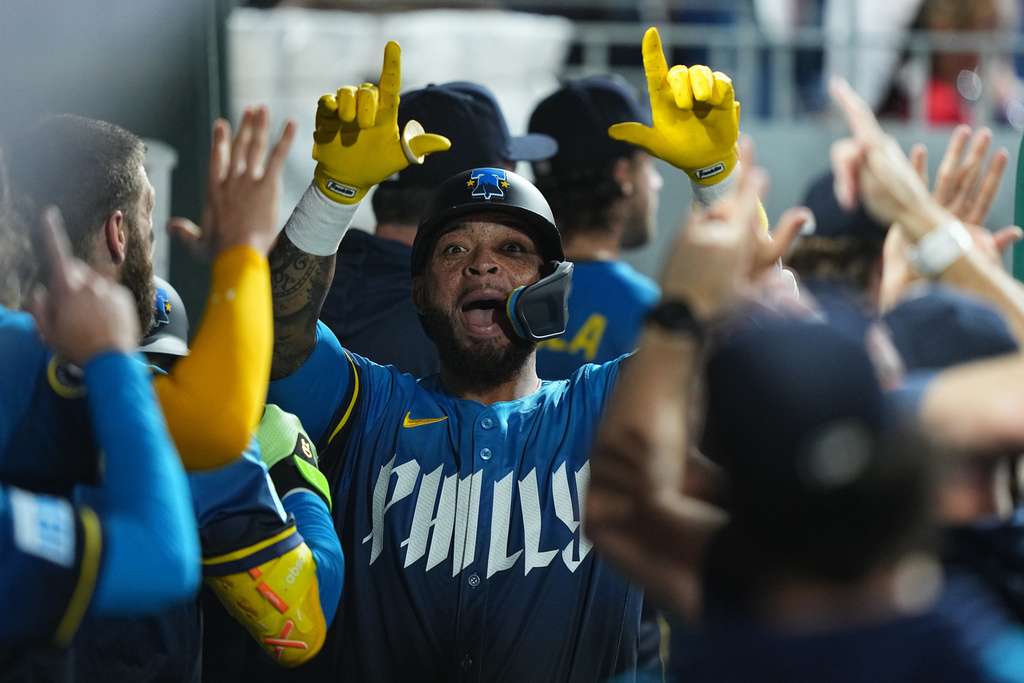 Philadelphia Phillies' Edmundo Sosa celebrates his home run off to Minnesota Twins pitcher Joe Ryan during the fifth inning of a baseball game, Friday, Sept. 26, 2025, in Philadelphia. (AP Photo/Matt Rourke)
