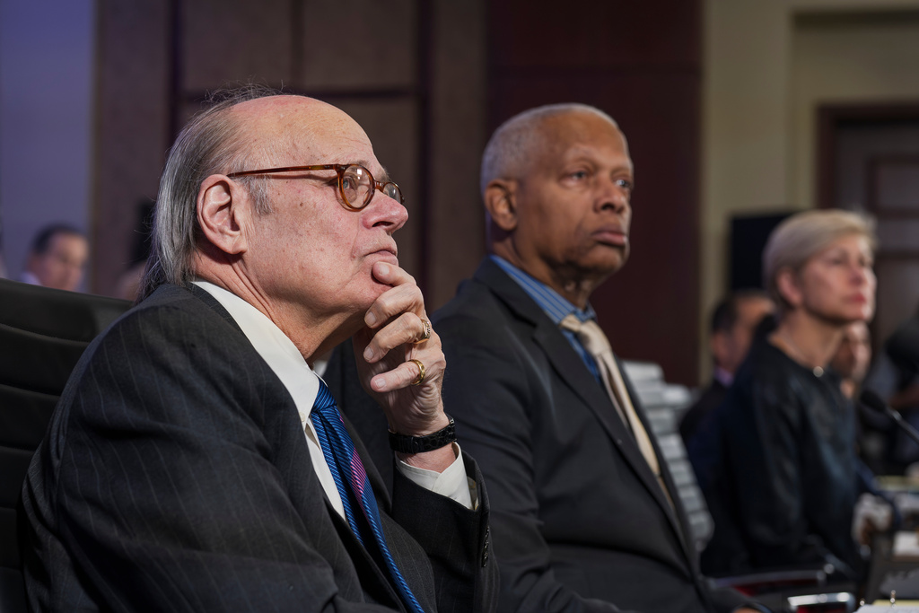 As House Democrats convene for an unofficial hearing on the 5th anniversary of the Jan. 6, 2021, riot by supporters of President Donald Trump, Rep. Steve Cohen, D-Tenn., left, and Rep. Hank Johnson, D-Ga., watch a video showing the storming of Capitol and the violent attack on Capitol Police officers, at the Capitol in Washington, Tuesday, Jan. 6, 2026. (AP Photo/J. Scott Applewhite)