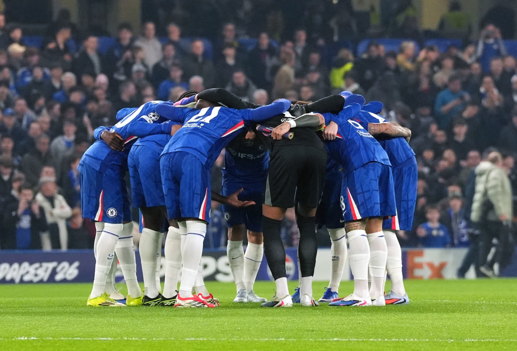 Chelsea players huddle before the Champions League soccer match between Chelsea and Paris Saint-Germain in London, England, Tuesday, March 17, 2026. (Adam Davy/PA via AP)