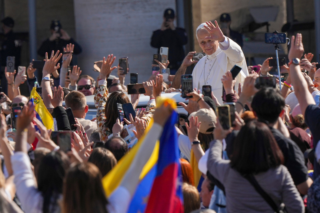 Pope Leo XIV tours on his popemobile after presiding over a Mass in St. Peter's Square at the Vatican during which he canonized seven new saints of the Catholic Church, Sunday, Oct. 19, 2025. (AP Photo/Andrew Medichini)