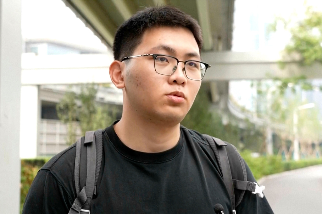 In the image taken from video, Xiang Ziyu, post-graduate student speaks on the streets of Beijing, Friday, Sept. 25, 2026. (AP Photo/Wu Jia)