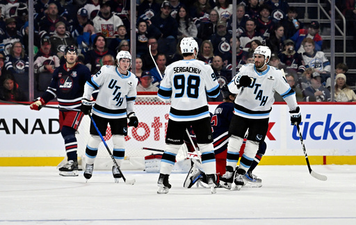 Utah Mammoth's Mikail Sergachev (98) celebrates after his goal against the Winnipeg Jets with Nick Schmaltz (8) during the second period of an NHL hockey game in Winnipeg, Manitoba, Sunday, Oct. 26, 2025. (Fred Greenslade/The Canadian Press via AP) Utah Mammoth's Mikail Sergachev (98) celebrates after his goal against the Winnipeg Jets with Nick Schmaltz (8) during the second period of an NHL hockey game in Winnipeg, Manitoba, Sunday, Oct. 26, 2025. (Fred Greenslade/The Canadian Press via AP)