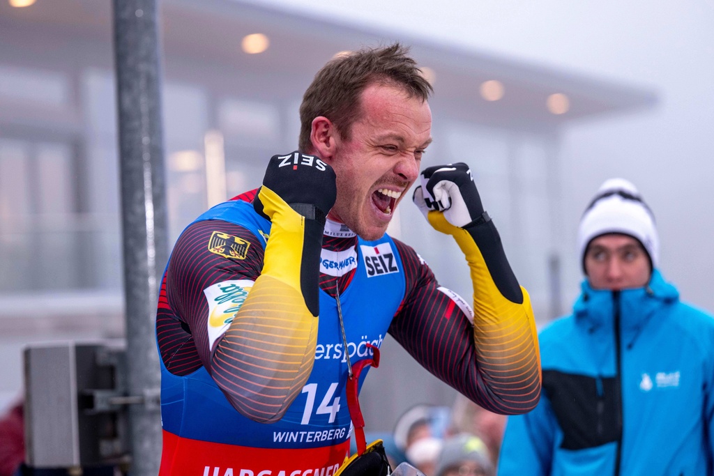 Felix Loch of Germany celebrates after the finish during the men's singles second run at the Luge World Championships in Winterberg, Germany, Saturday, Dec. 6, 2025. (David Inderlied/dpa via AP)