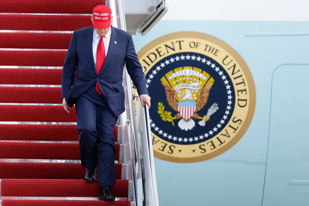 President Donald Trump walks down the stairs of Air Force One upon his arrival at Joint Base Andrews, Md., Thursday, Oct. 30, 2025, after returning from Asia. (AP Photo/Luis M. Alvarez)