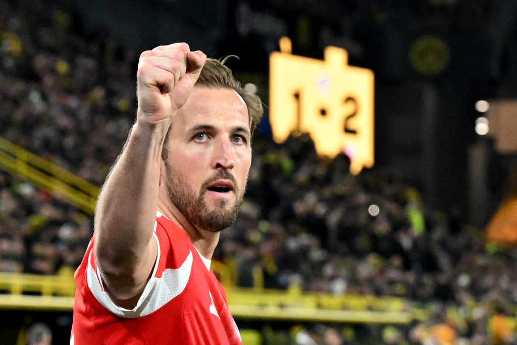 Bayern Munich's Harry Kane celebrates scoring during the Bundesliga soccer match between Borussia Dortmund and FC Bayern Munich in Dortmund, Germany, Saturday Feb. 28, 2026. (Federico Gambarini/dpa via AP)