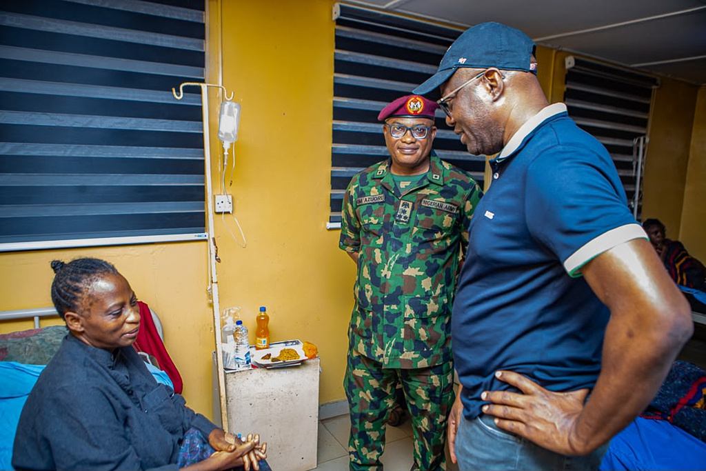 In this photo released by Oyo state government House, Governor Seyi Makinde, right, visits a teacher abducted in May by Islamic militants, following her release at a hospital in southwestern Oyo, Nigeria, Saturday, July 11, 2026. (Oyo State government House via AP)