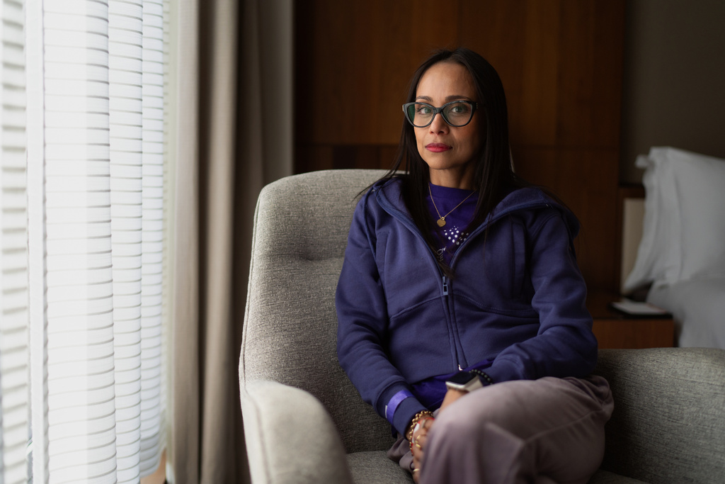 Ruth Wilson, who balances her lupus illness with volunteering to help other patients, sits for a portrait, Saturday, Oct. 18, 2025, in New York. (AP Photo/David Goldman)
