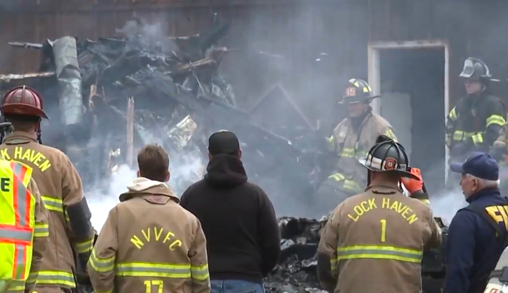 This photo made from video from WNEP shows first responders at the scene of an explosion and fire in Lamar Township near Mill Hall, Pa., Sunday, April 19, 2026. (WNEP via AP)