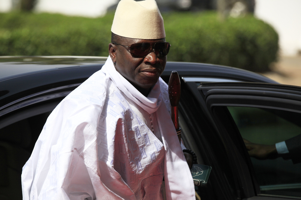 FILE - Gambia's President Yahya Jammeh arrives for a summit to address a seminar on security in Abuja, Nigeria, on Feb. 27, 2014. (AP Photo/Sunday Alamba, File)