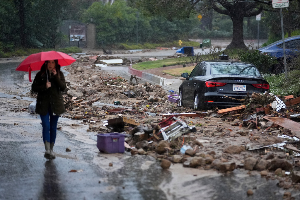 FILE - Mud and debris is strewn on Fryman Road during an atmospheric river Feb. 5, 2024, in Studio City Calif. (AP Photo/Marcio Jose Sanchez, File)