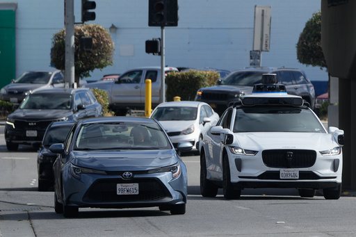 A Waymo vehicle, right, drives in San Bruno, Calif., Tuesday, Sept. 30, 2025. (AP Photo/Jeff Chiu) A Waymo vehicle, right, drives in San Bruno, Calif., Tuesday, Sept. 30, 2025. (AP Photo/Jeff Chiu)