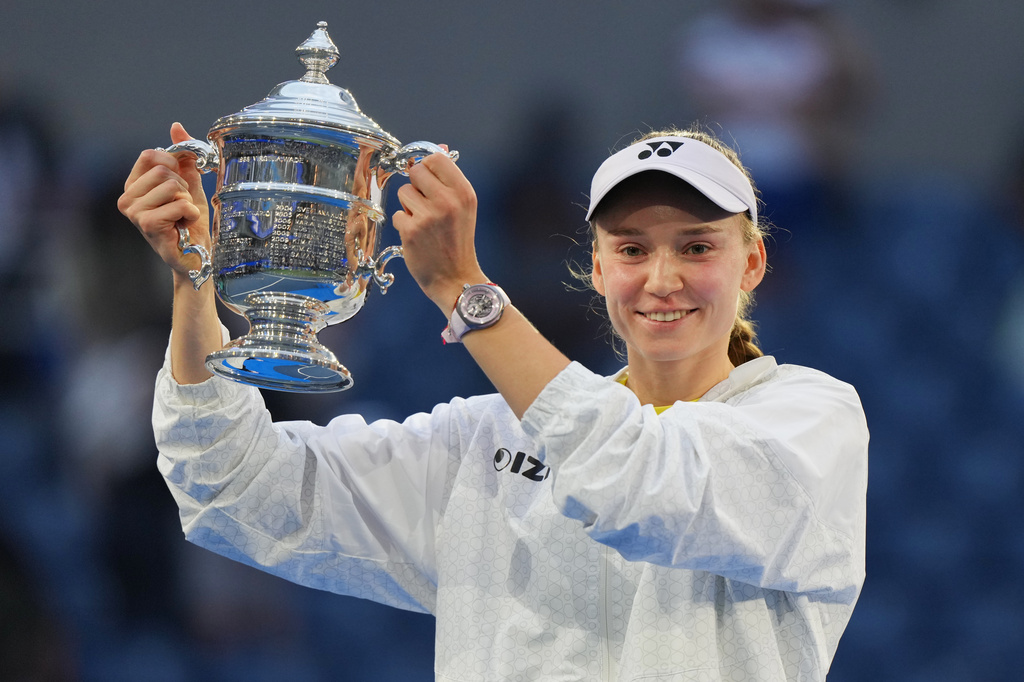 Elena Rybakina, of Kazakhstan, holds the trophy after she won the women's singles final of the U.S. Open tennis championships against Aryna Sabalenka, of Belarus, Saturday, Sept. 12, 2026, in New York. (AP Photo/Kirsty Wigglesworth)
